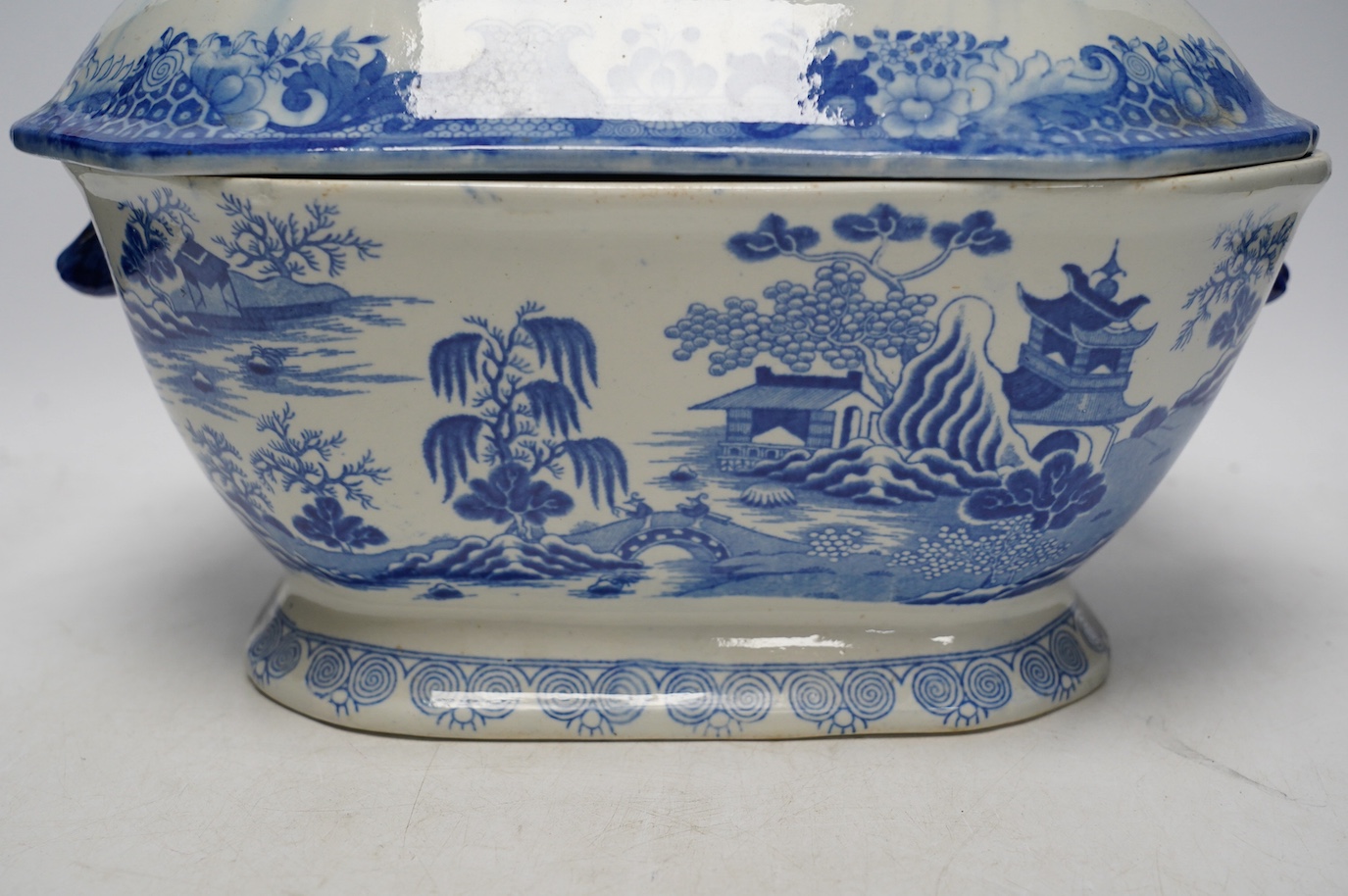 A Victorian Staffordshire blue and white pottery soup tureen and cover, together with a meat dish (2). Condition - tureen cover cracked